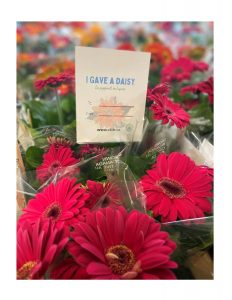 Photo of gerbera daisies and I gave a daisy card.