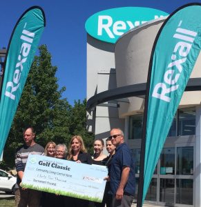 Rexall sponsored the 2022 Goderich and District Golf Classic. Photo with Golf Chair, volunteer and Rexall Staff.